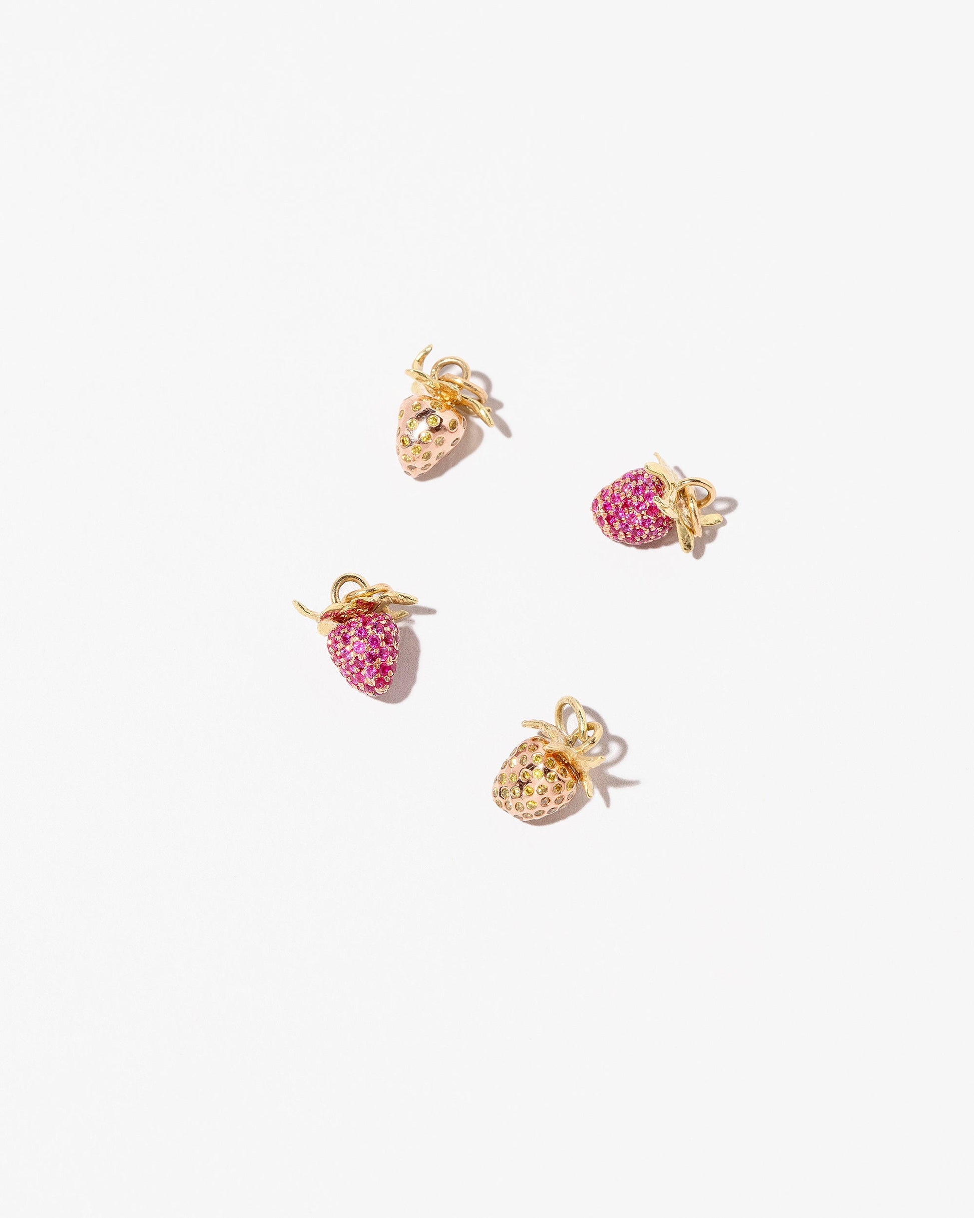 Group of Strawberry Charm - Wild, Ripe, and Baby on light color background.
