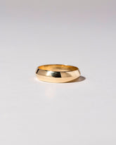 Gold 6mm Knife Edge Band on light color background.