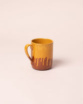 La Ceramica Vincenzo Del Monaco Caramel Yellow Coffee Mug on light color background.