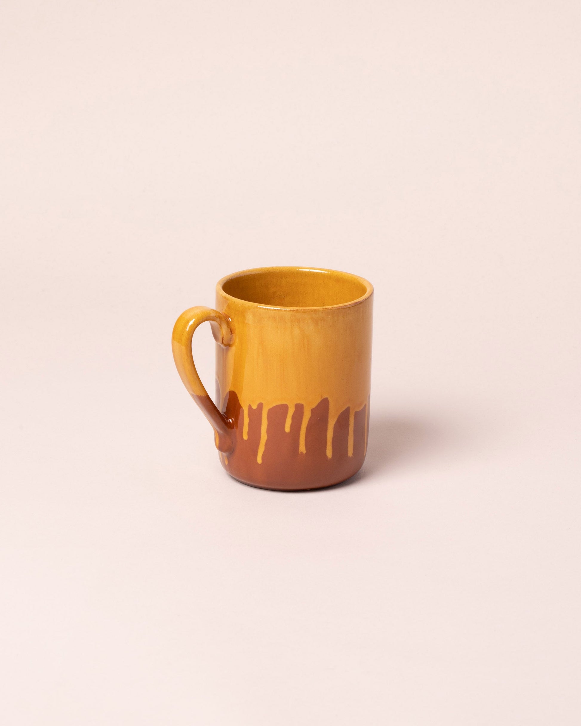 La Ceramica Vincenzo Del Monaco Caramel Yellow Coffee Mug on light color background.