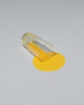 Spills Faux Diner Orange Juice Spill on light color background.