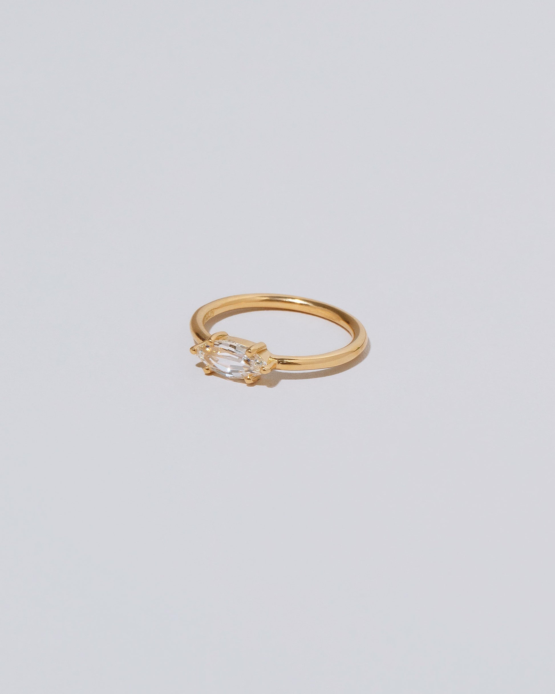 View from the side of the Ouvert Ring on light color background.