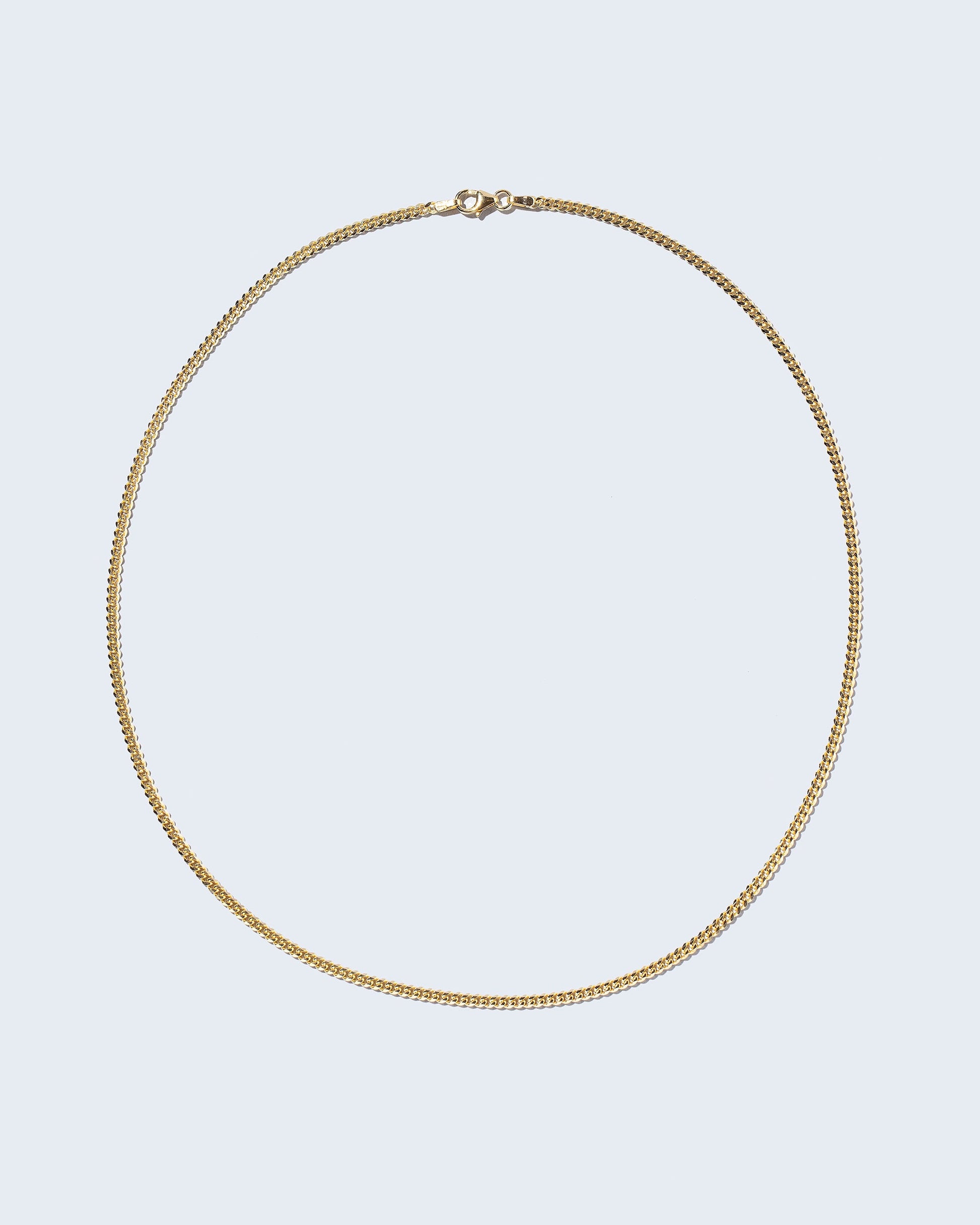 2.4mm Curb Chain Necklace on light color background.