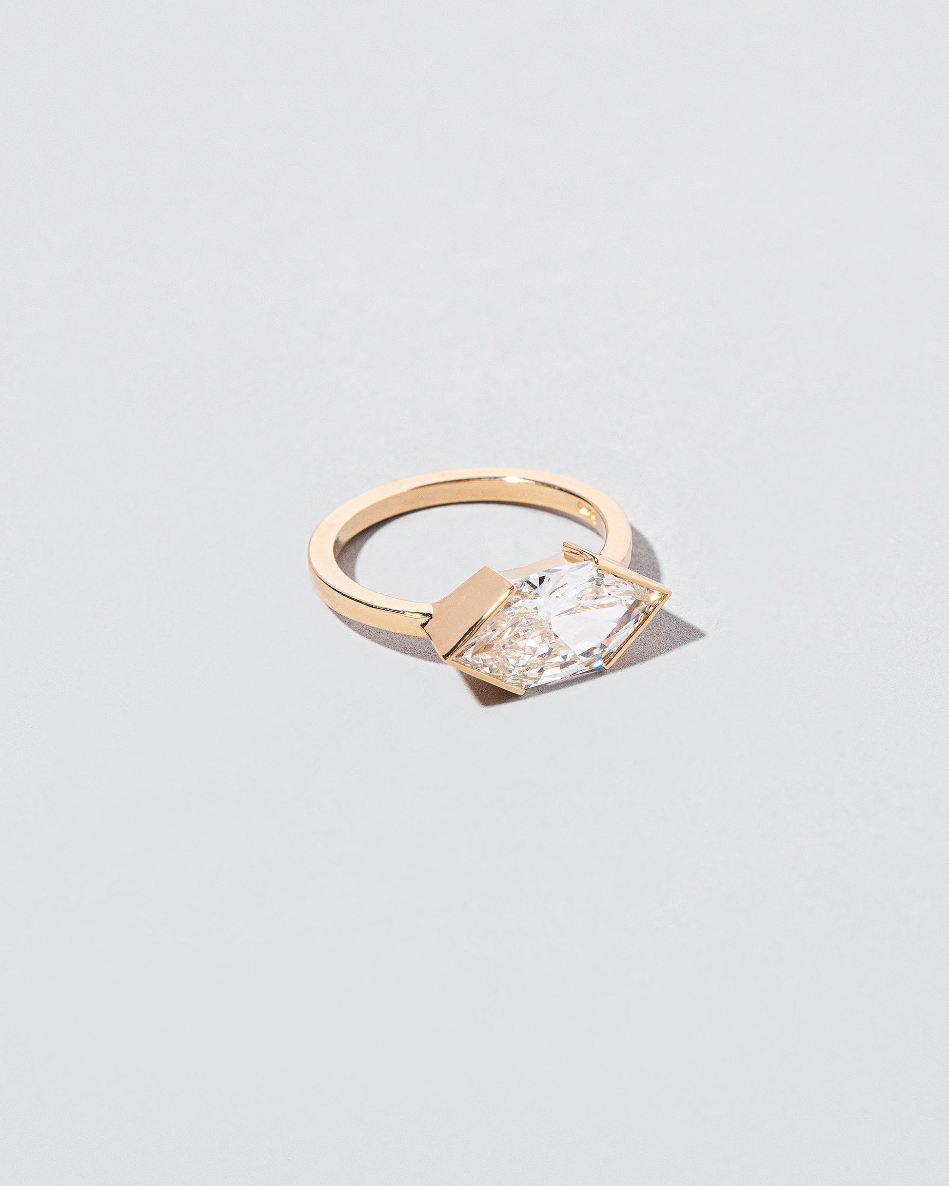 View from the side of the Vertex Ring on light color background.