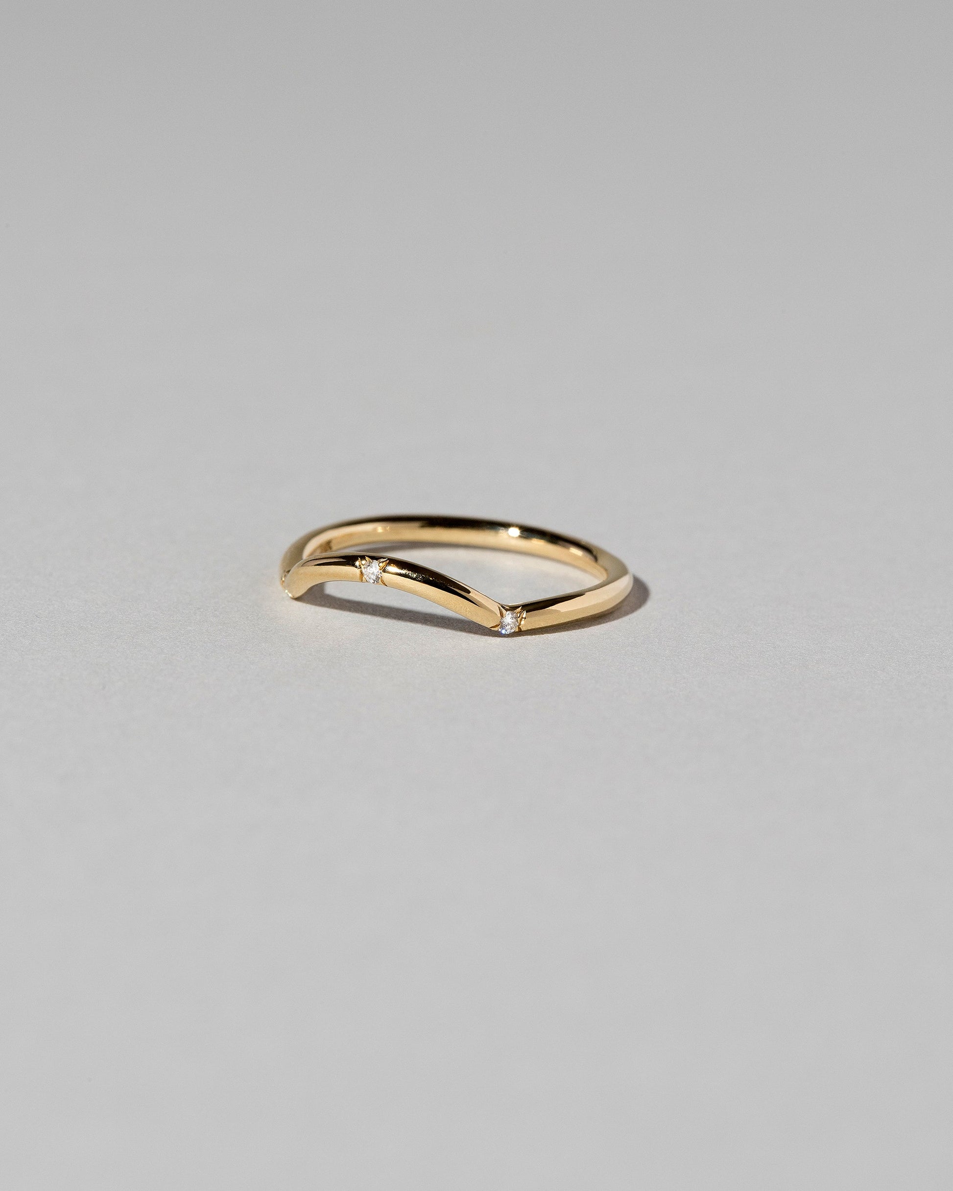  Mini Curve Band - Three Stone on light color background.