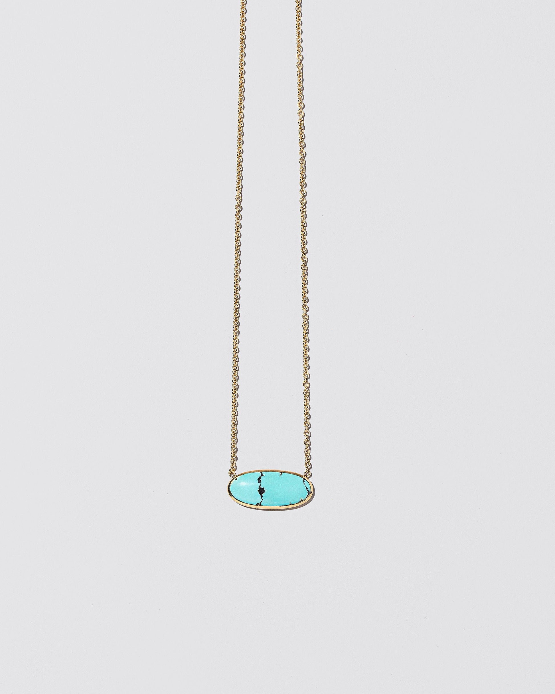 Waters Necklace on light color background.