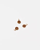  Sliced Fruit Charms - Orange on light color background.