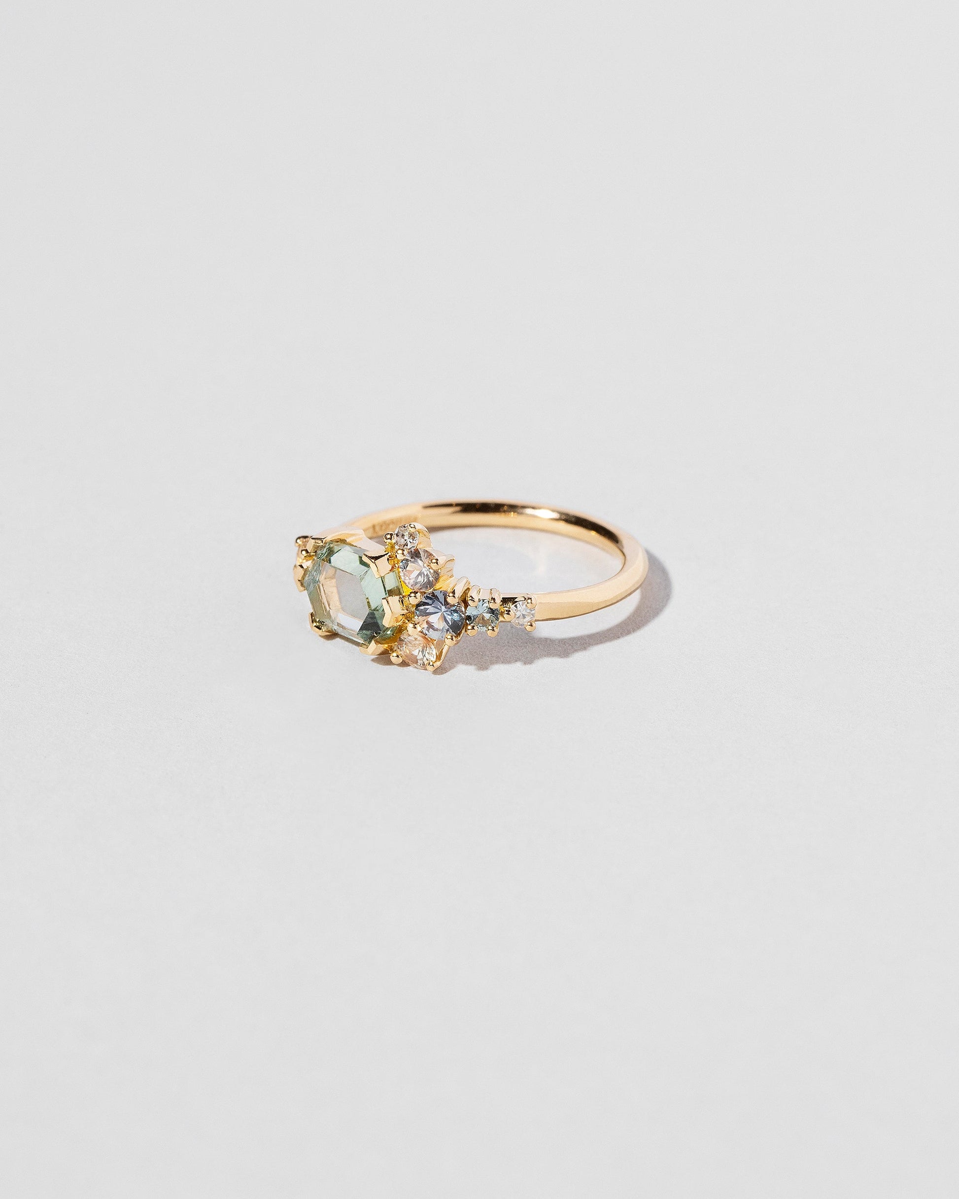  Hexagonal Slice Sapphire Cluster Ring on light color background.