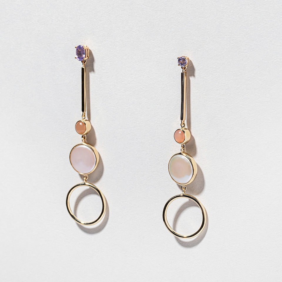 product_details:: Act 3. Earrings on light color background.