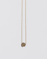 Full Black Diamond Spiral Necklace on light color background.