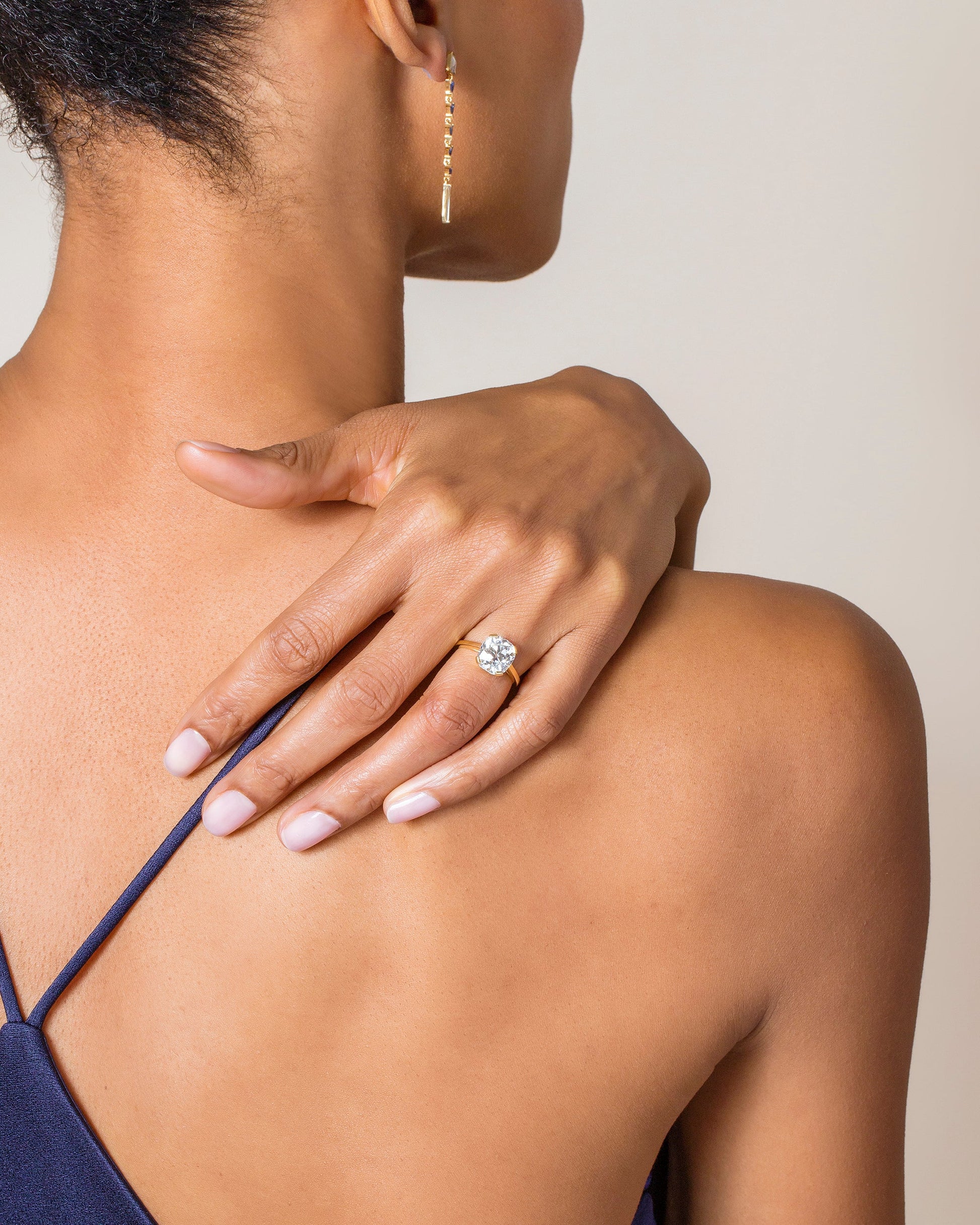 Cushion Cut Diamond Solitaire Ring on model.