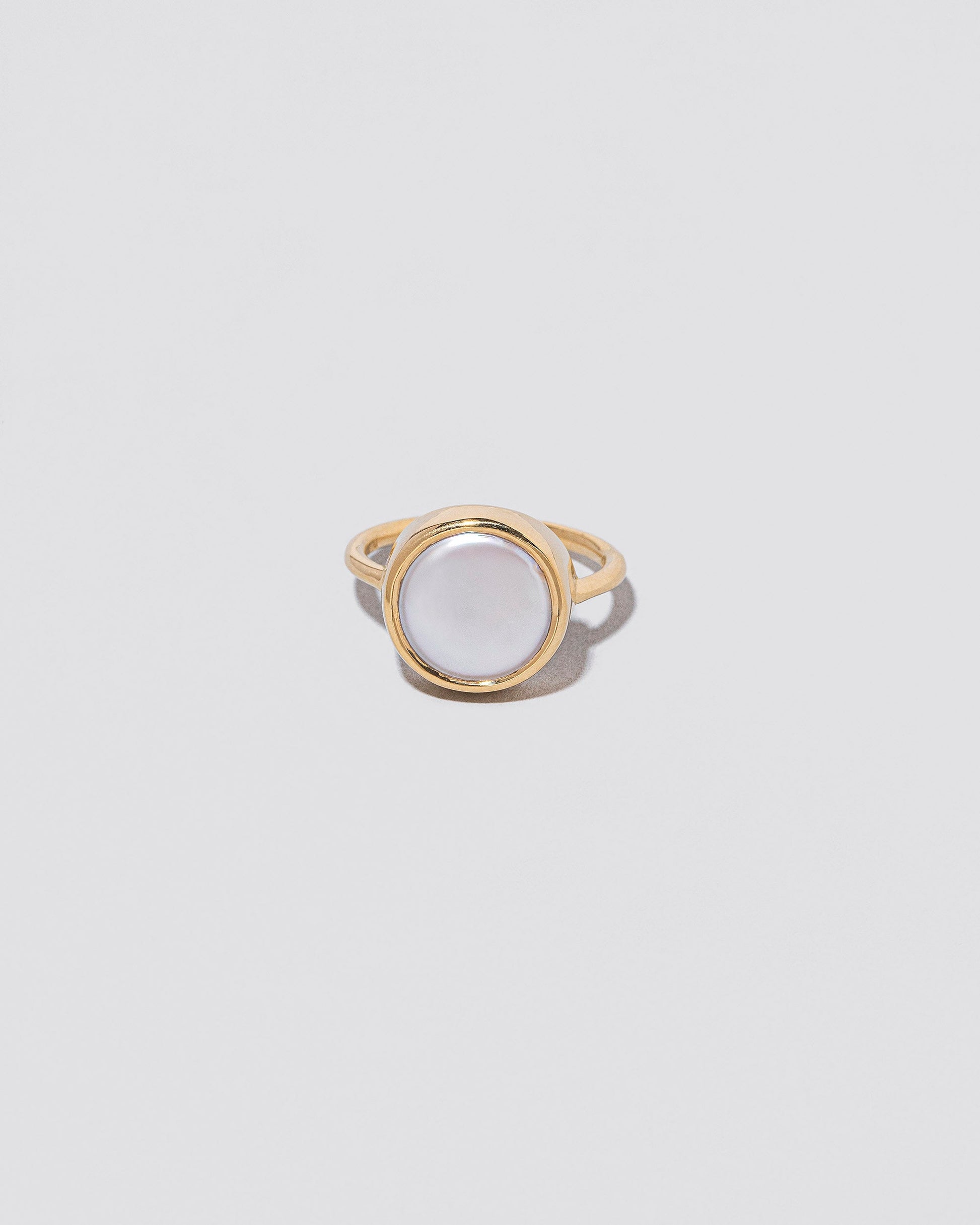 Atlas Ring on light color background.