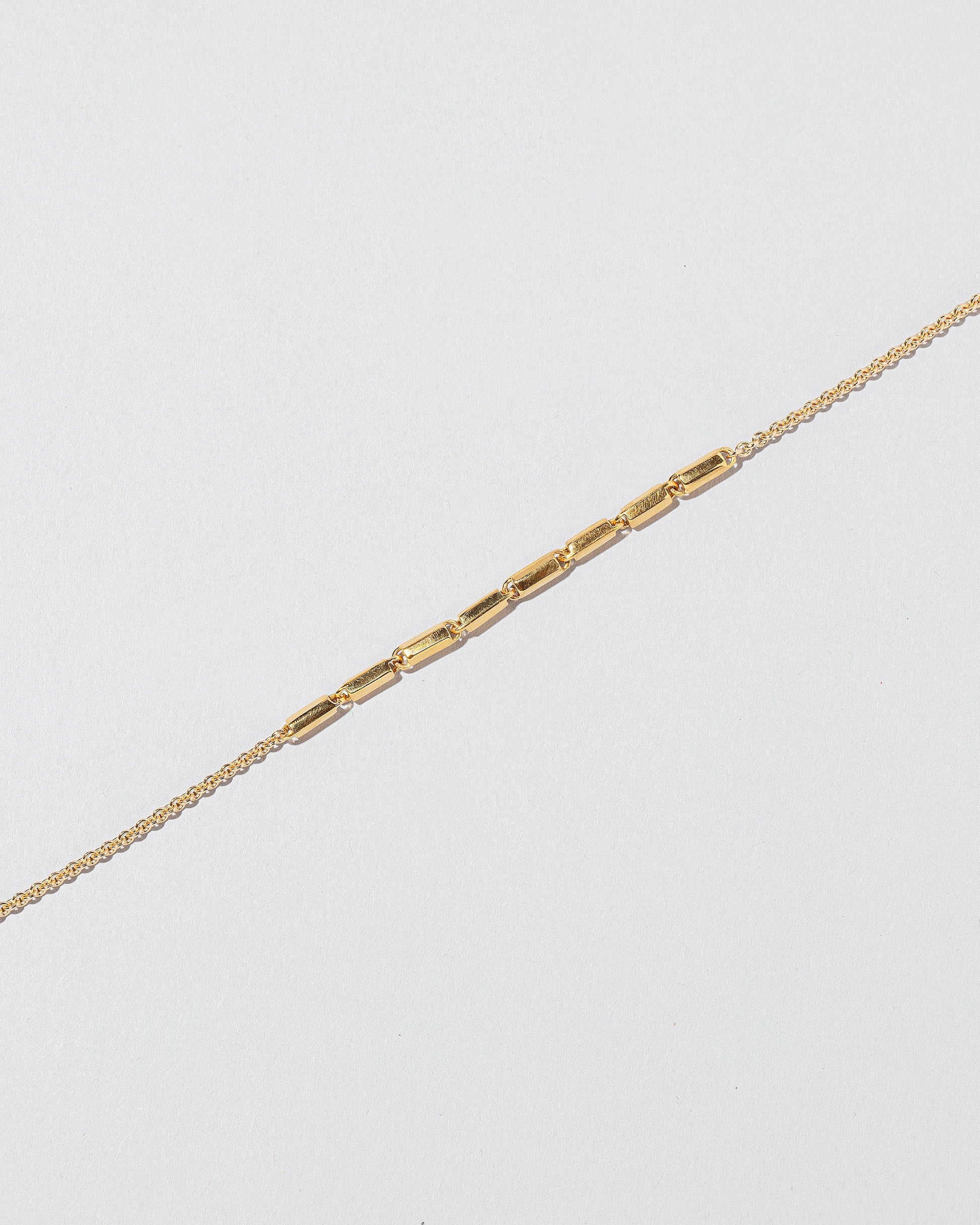  Inclusion Bracelet on light color background.