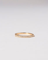 Gold Pavé 1.7mm Segmented Half Hoop Band on light color background.