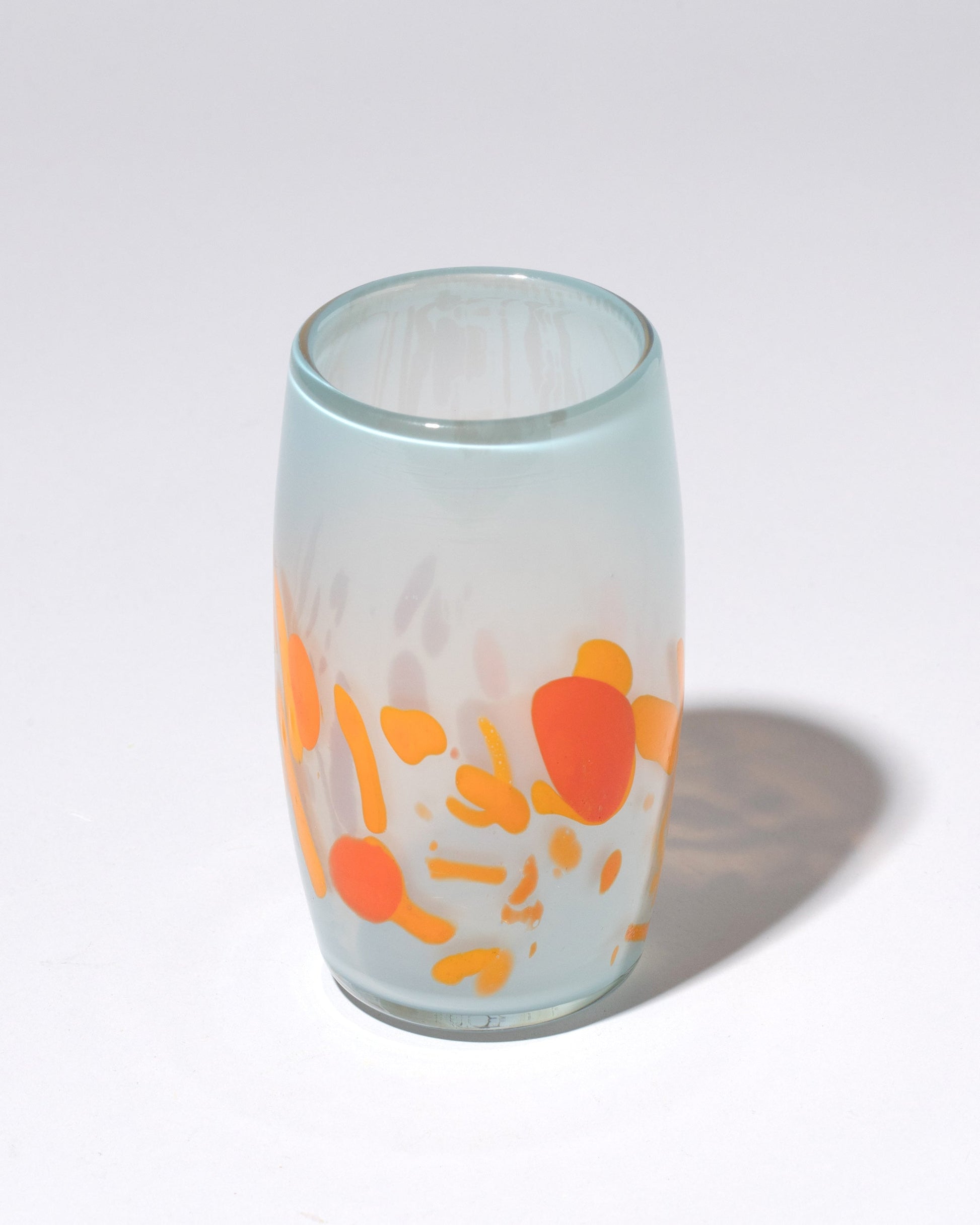 Closeup detail of the Sirius Glassworks DNA Tumbler on light color background.