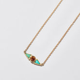 product_details:: Sunstone & Turquoise Eye Necklace on light color background.