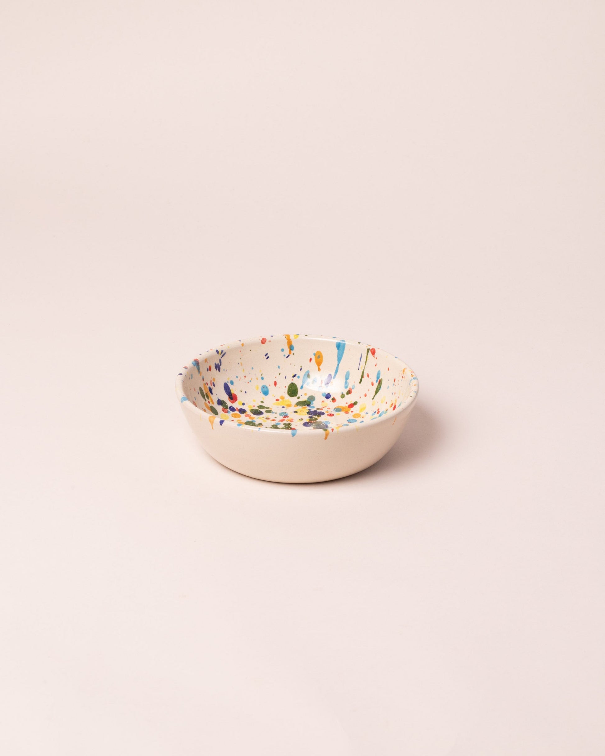 La Ceramica Vincenzo Del Monaco Colored Drops Cereal Bowl on light color background.