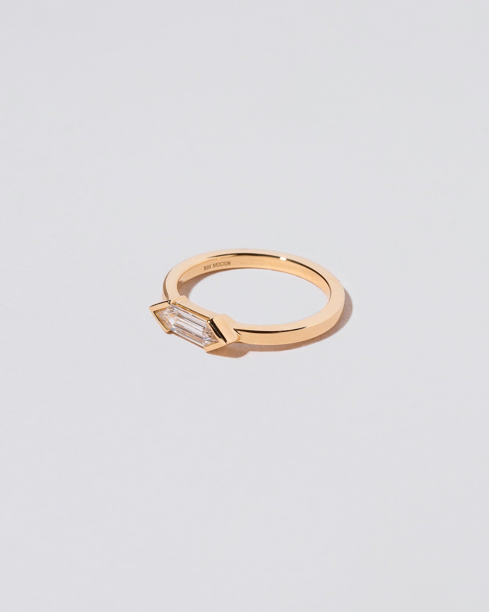 View from the side of the Paradise Ring on light color background.