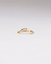Gold Single Stone White Diamond Curve Band on light color background.
