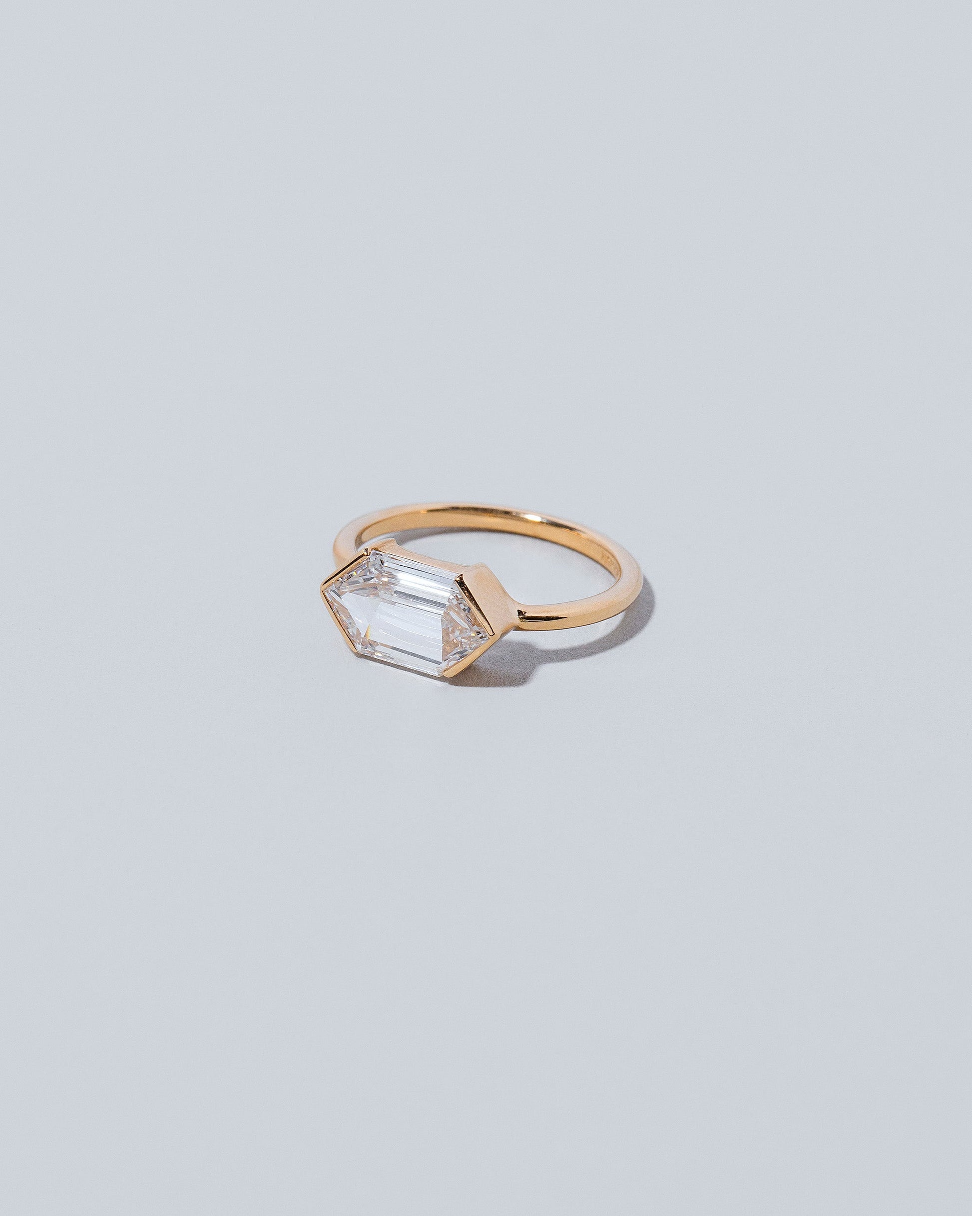 View from the side of the Headstrong Ring on light color background.