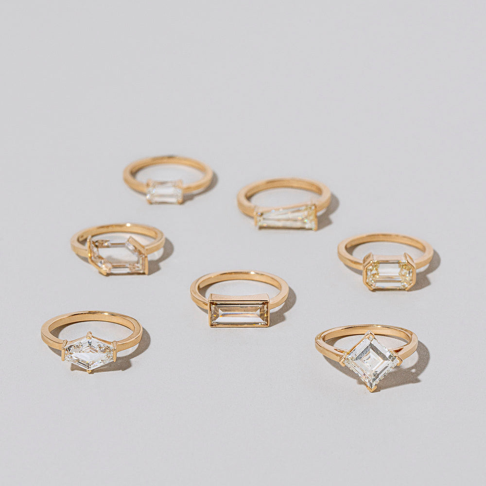 product_details::Group of Heart & Soul Rings on light color background.