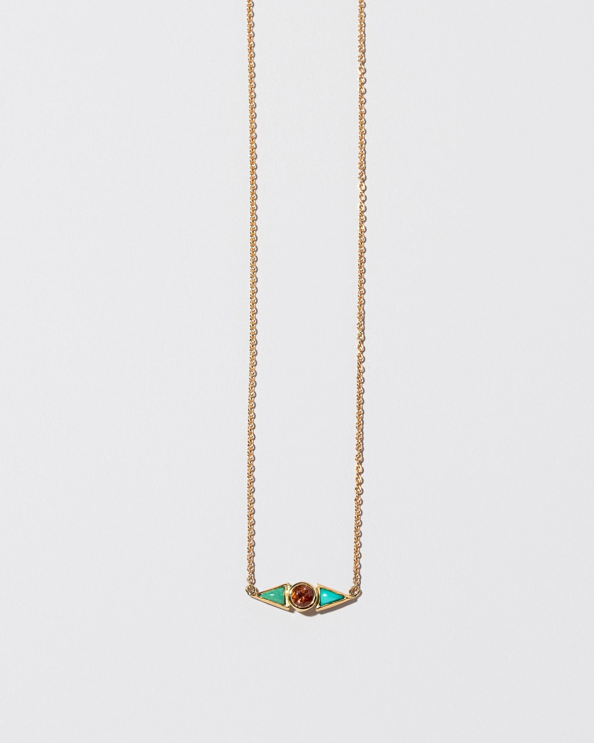  Sunstone & Turquoise Eye Necklace on light color background.