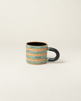 Recreation Center Dalmatian Stripe Mugs on light color background.