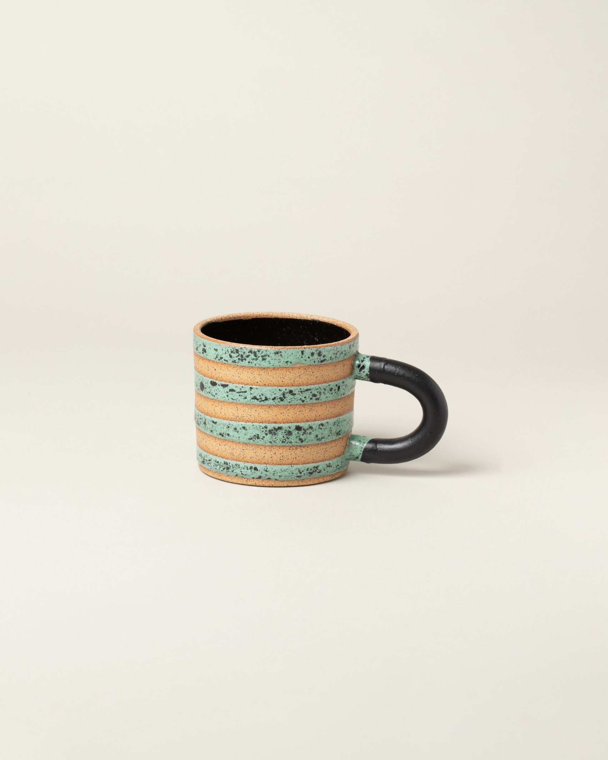 Recreation Center Dalmatian Stripe Mugs on light color background.