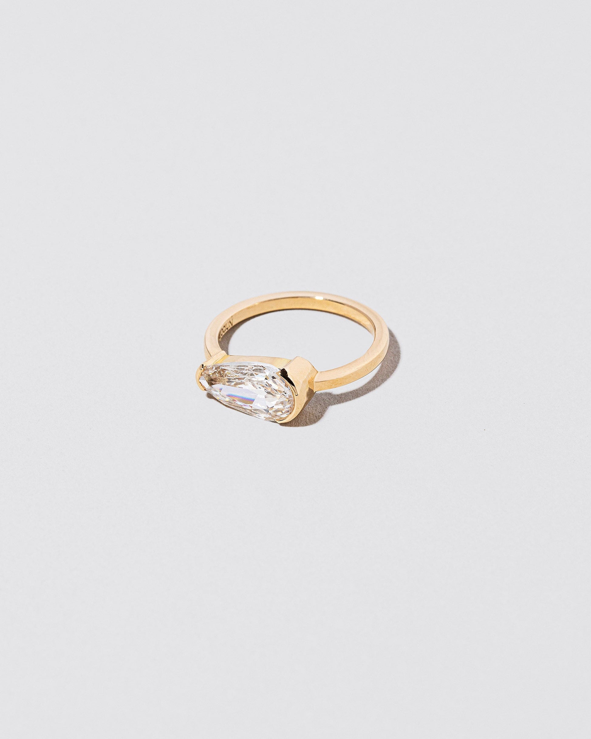 View from the side of the Divination Ring on light color background.