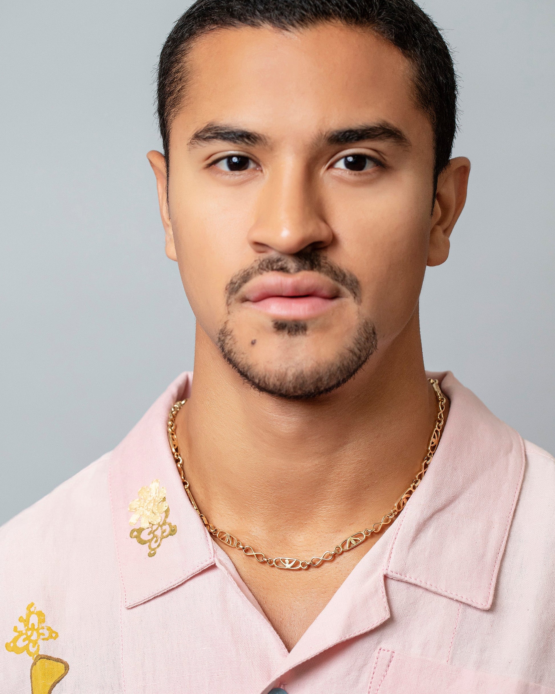 Infinite Spiral Necklace on male model.