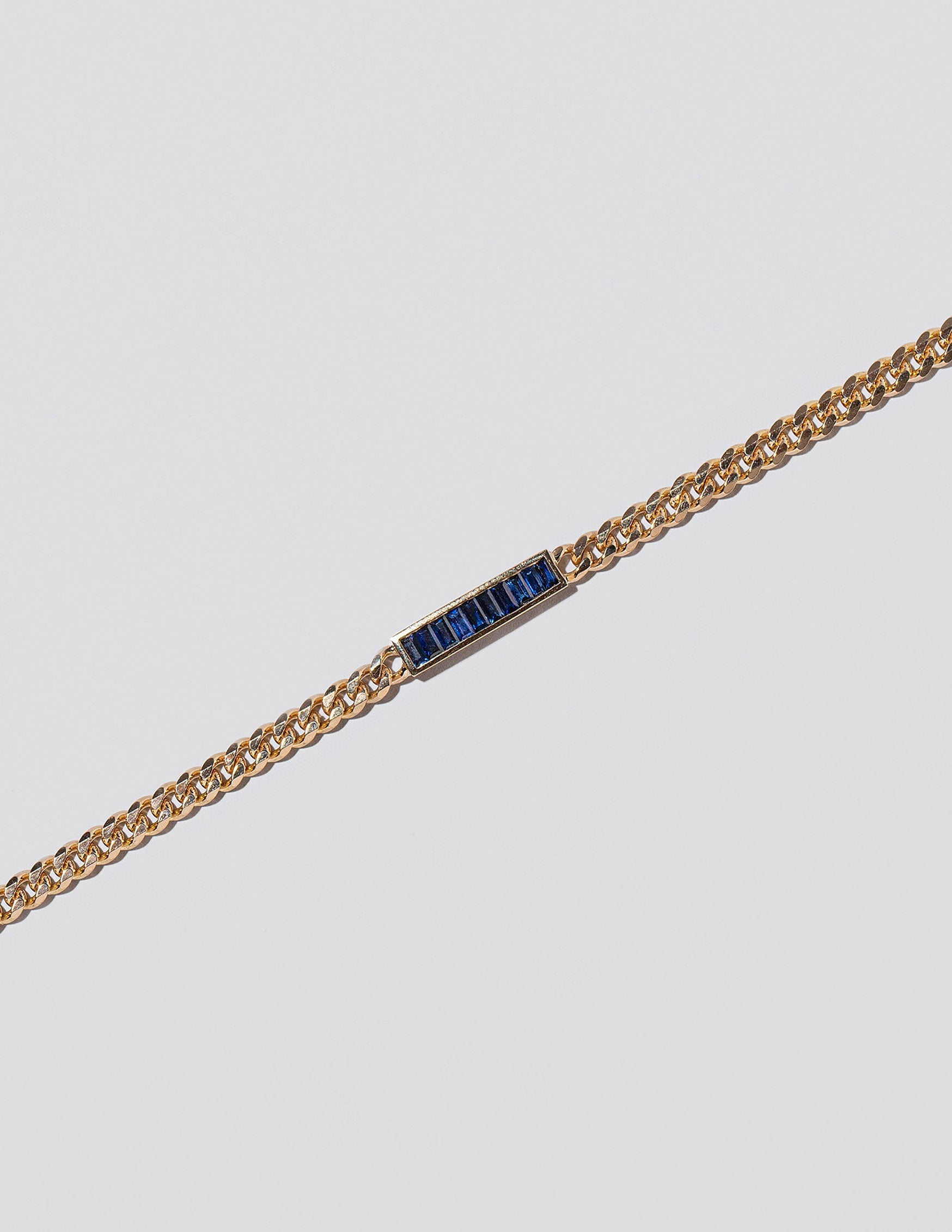 Identity Chain Necklace on light colored background.