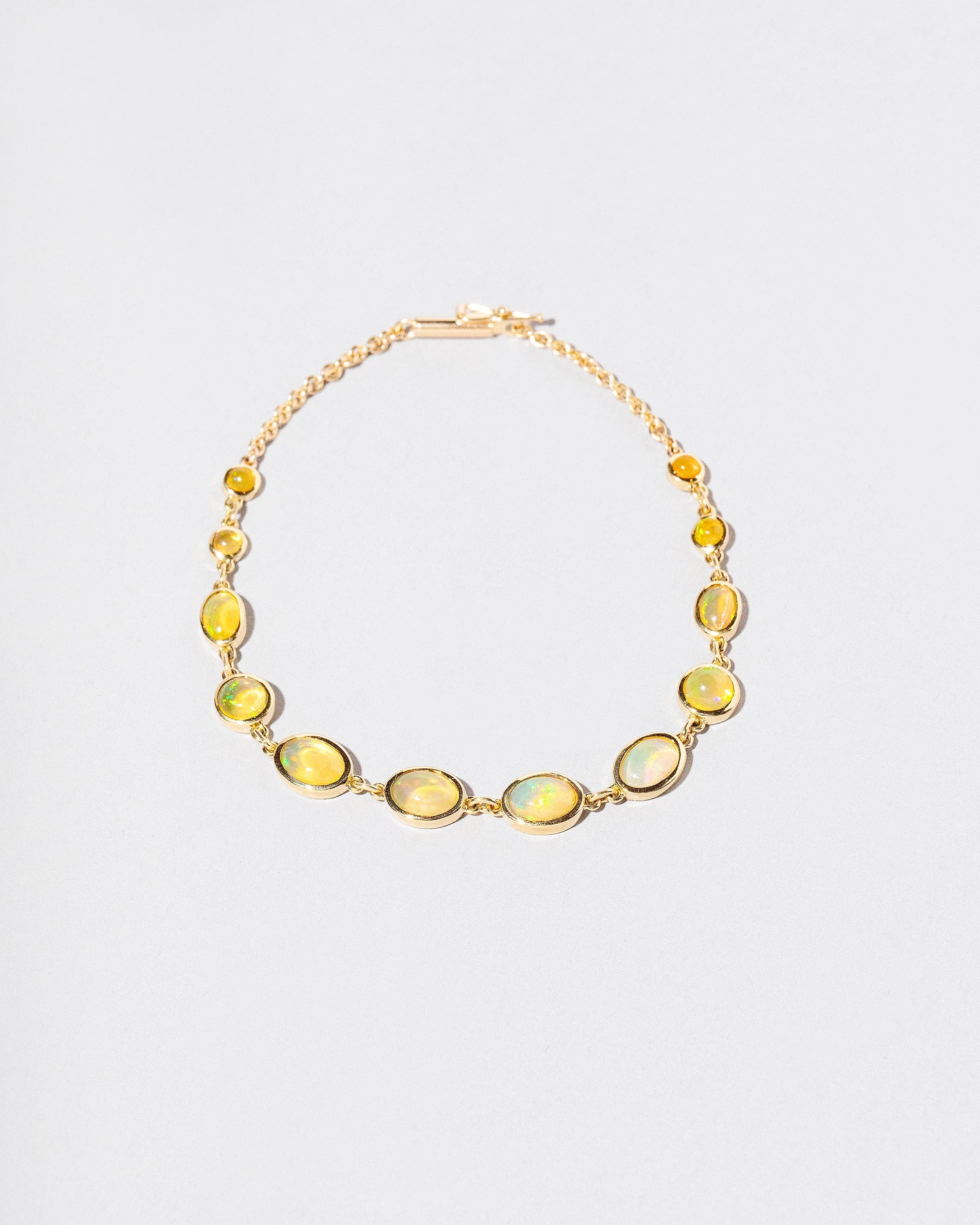  Saturn Bracelet on light color background.