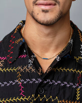 2.4mm Blue Sapphire Identity Chain Necklace on male model.