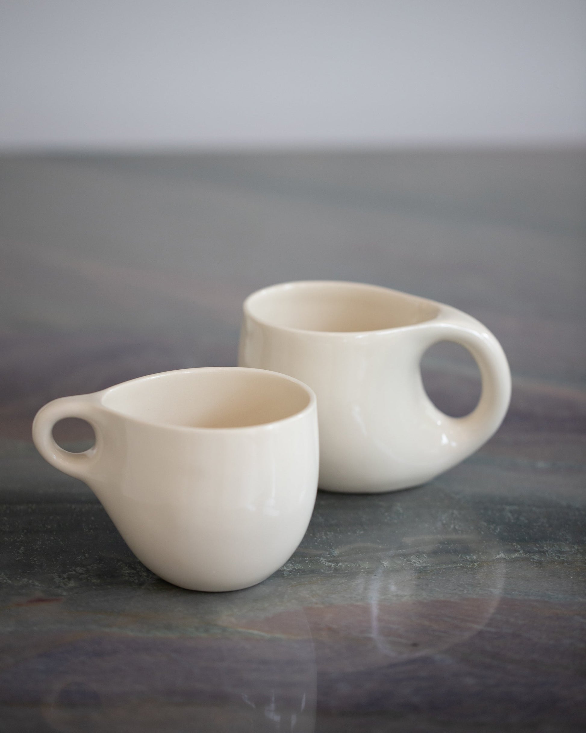 Styled image featuring Dust and Form Ritual Mug and Small Cream Comfort Mug.