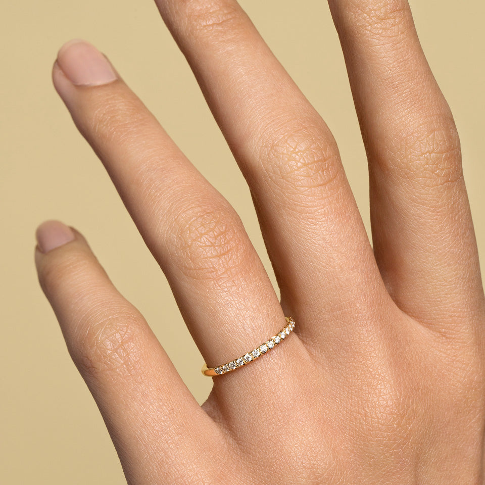 product_details::Gold White Diamond Fifteen Stone Dot Band on model.