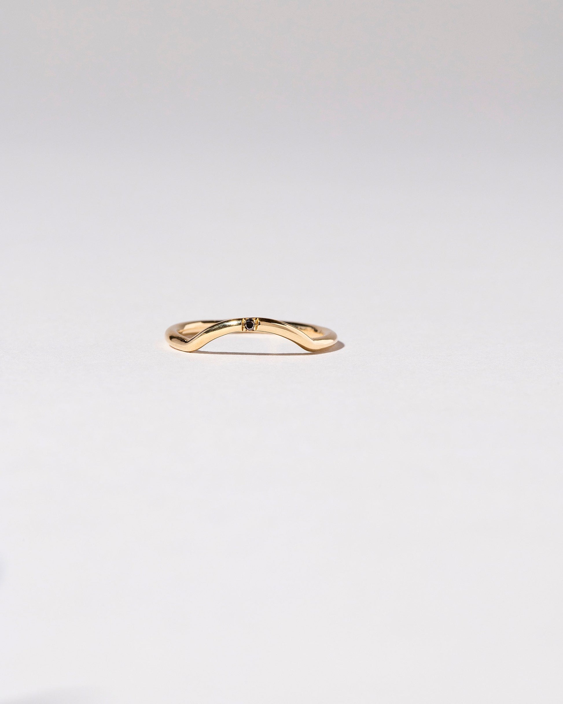  Mini Curve Band - Single Stone on light color background.