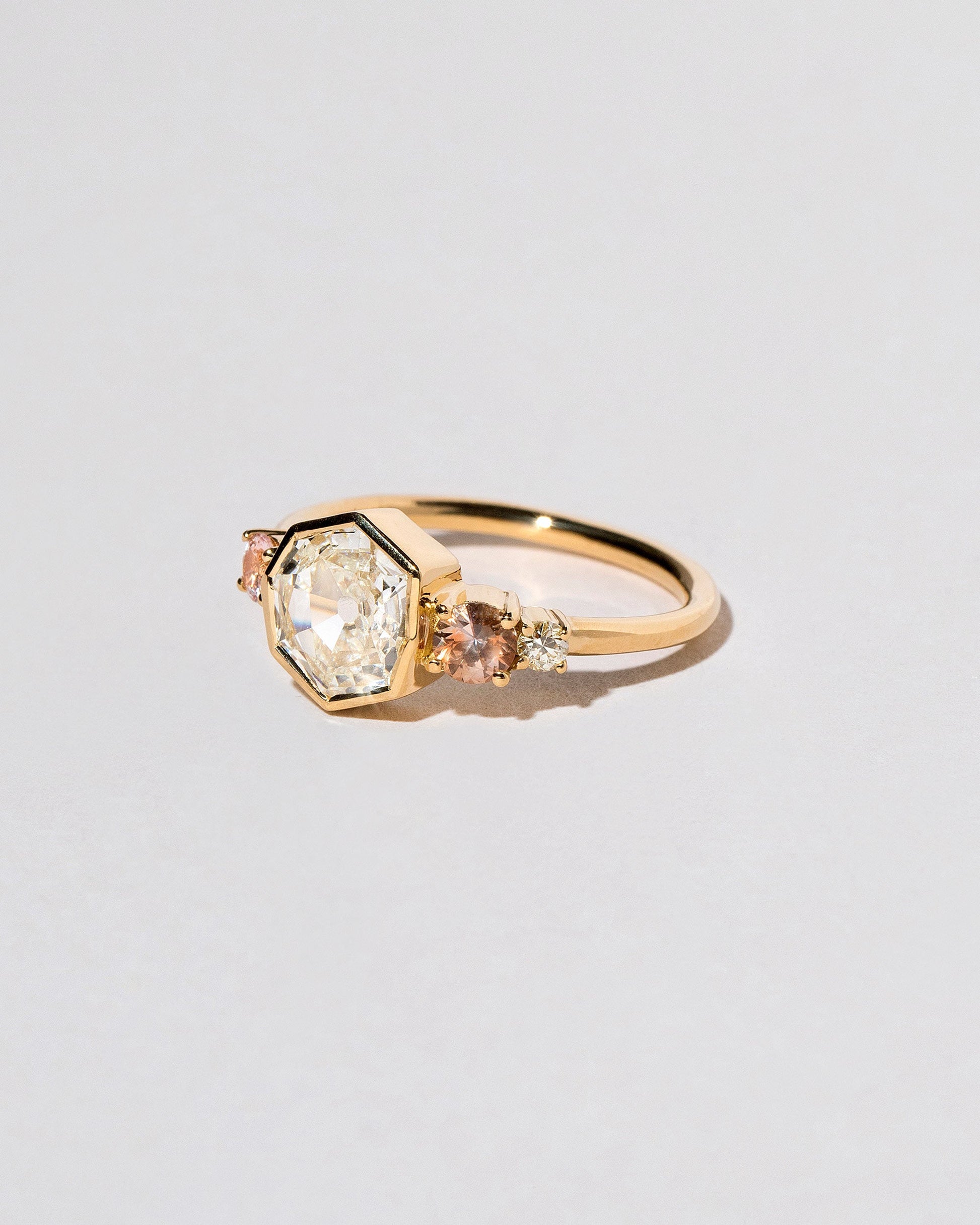  Theia Ring on light color background.