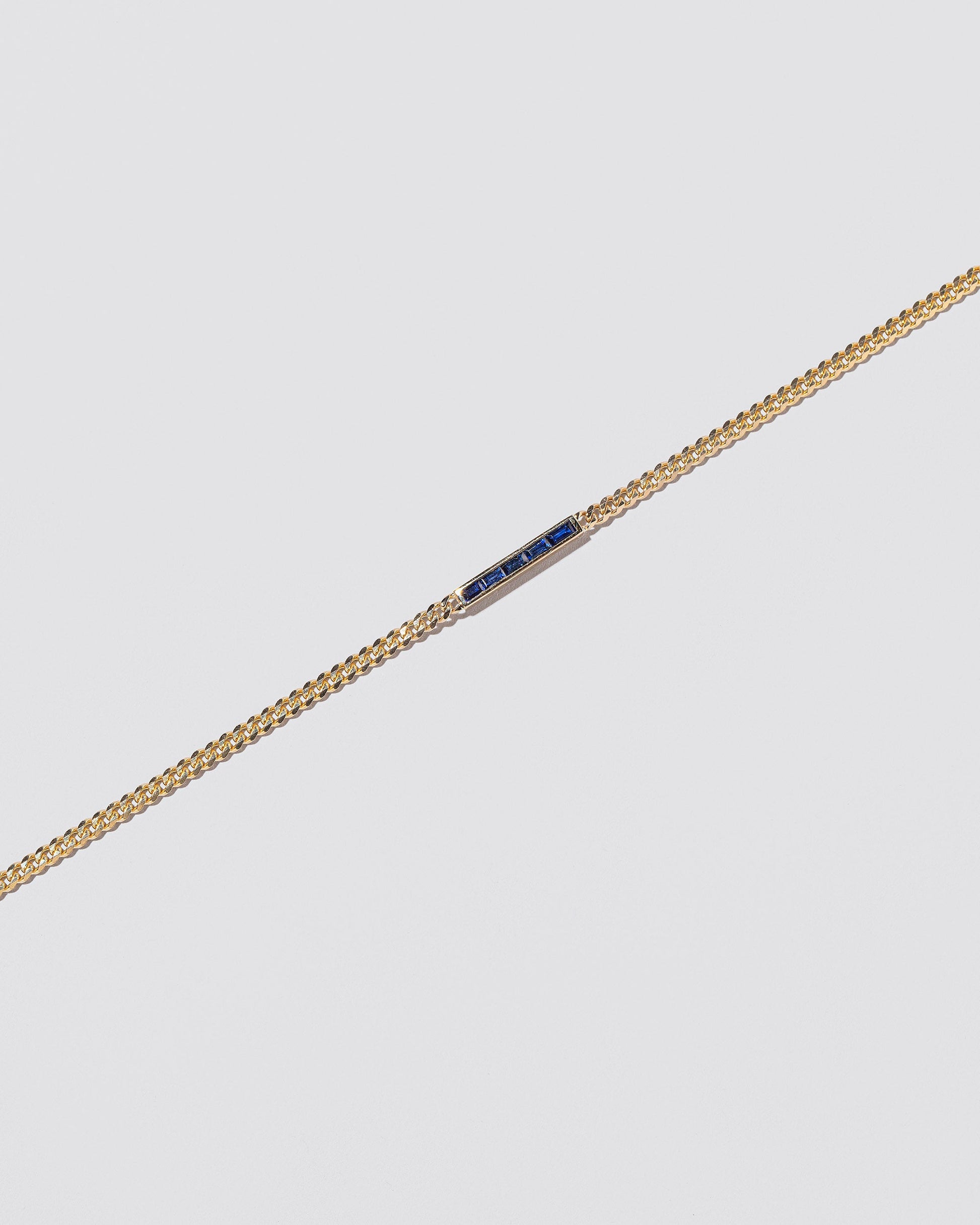 Identity Chain Necklace on light colored background.