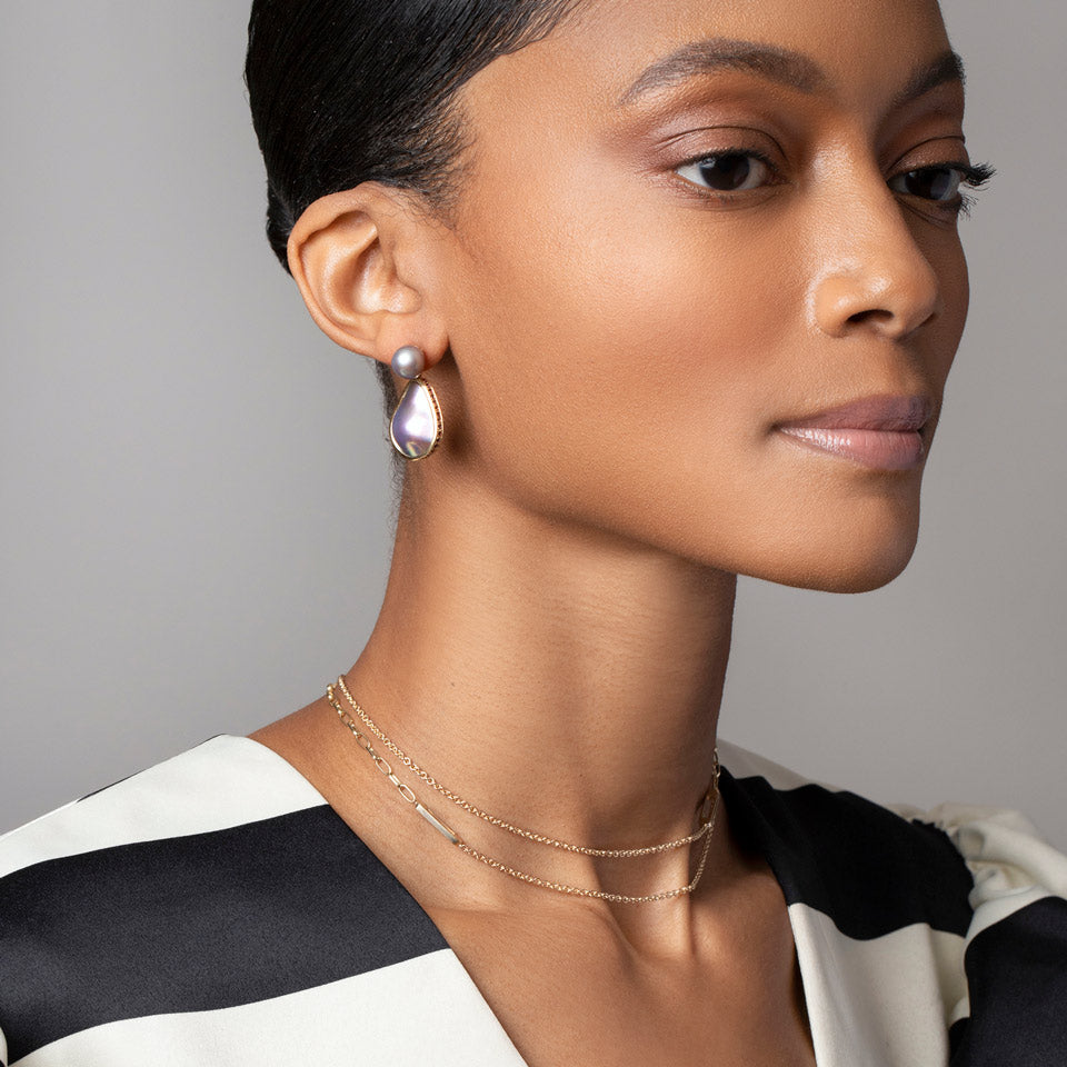 product_details::Soft Landscape Earrings on model.