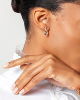 Dualism Earrings on model.