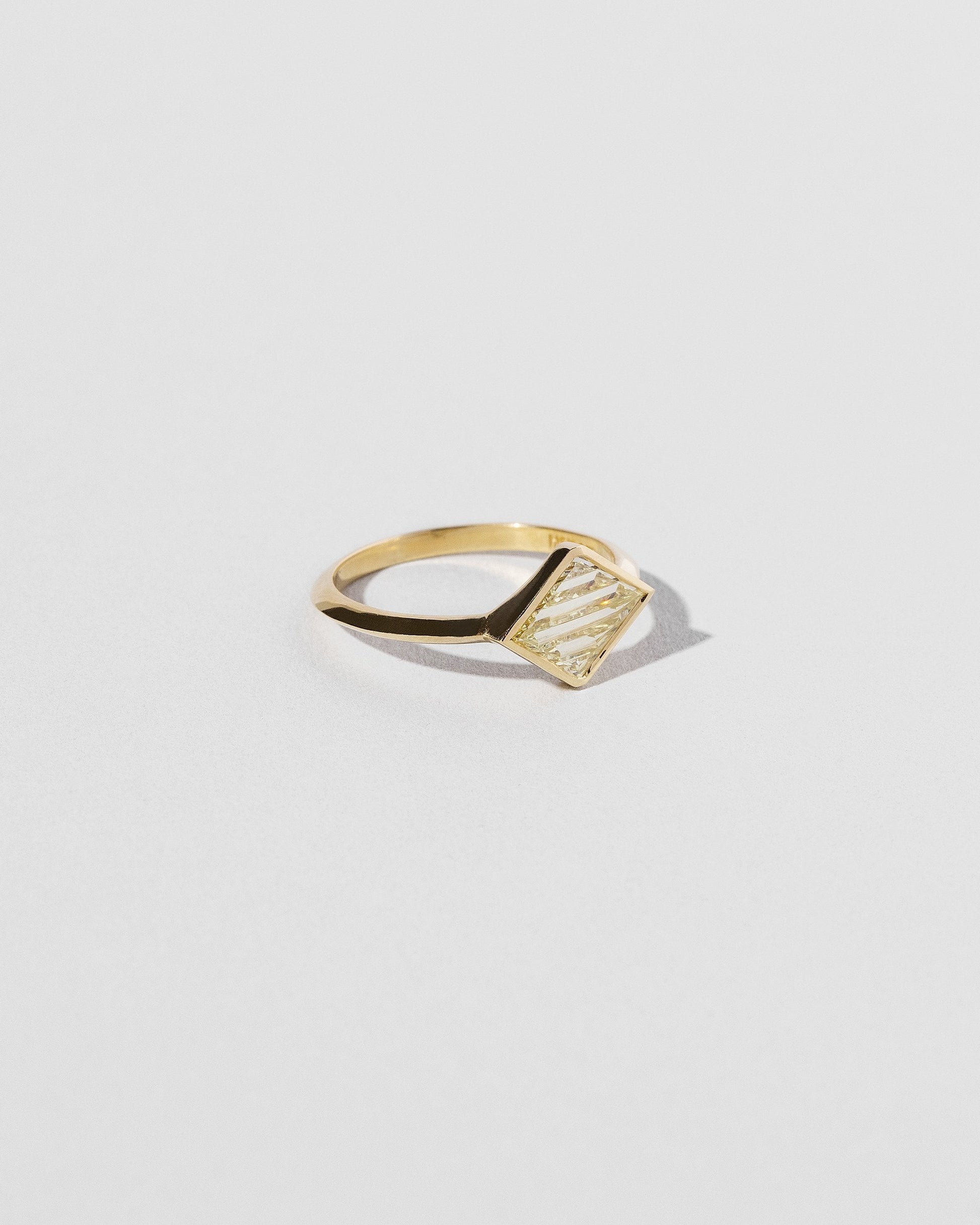 View from the side of the Aidos Ring on light color background.