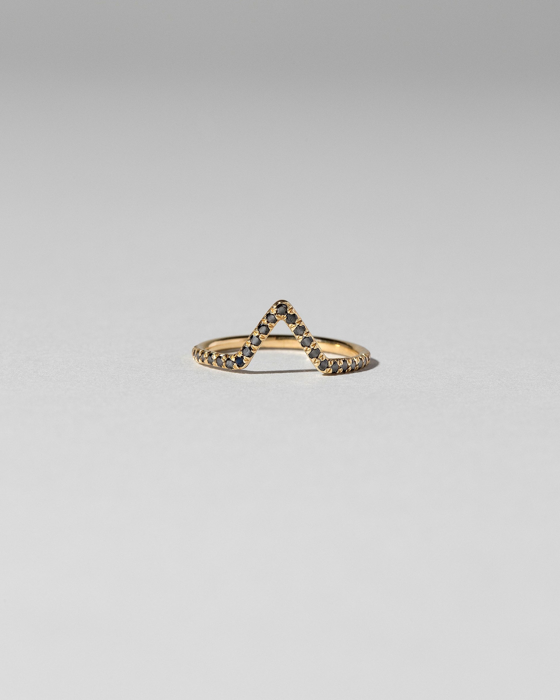 Black Diamond Pavé Triangle Band on light color background.