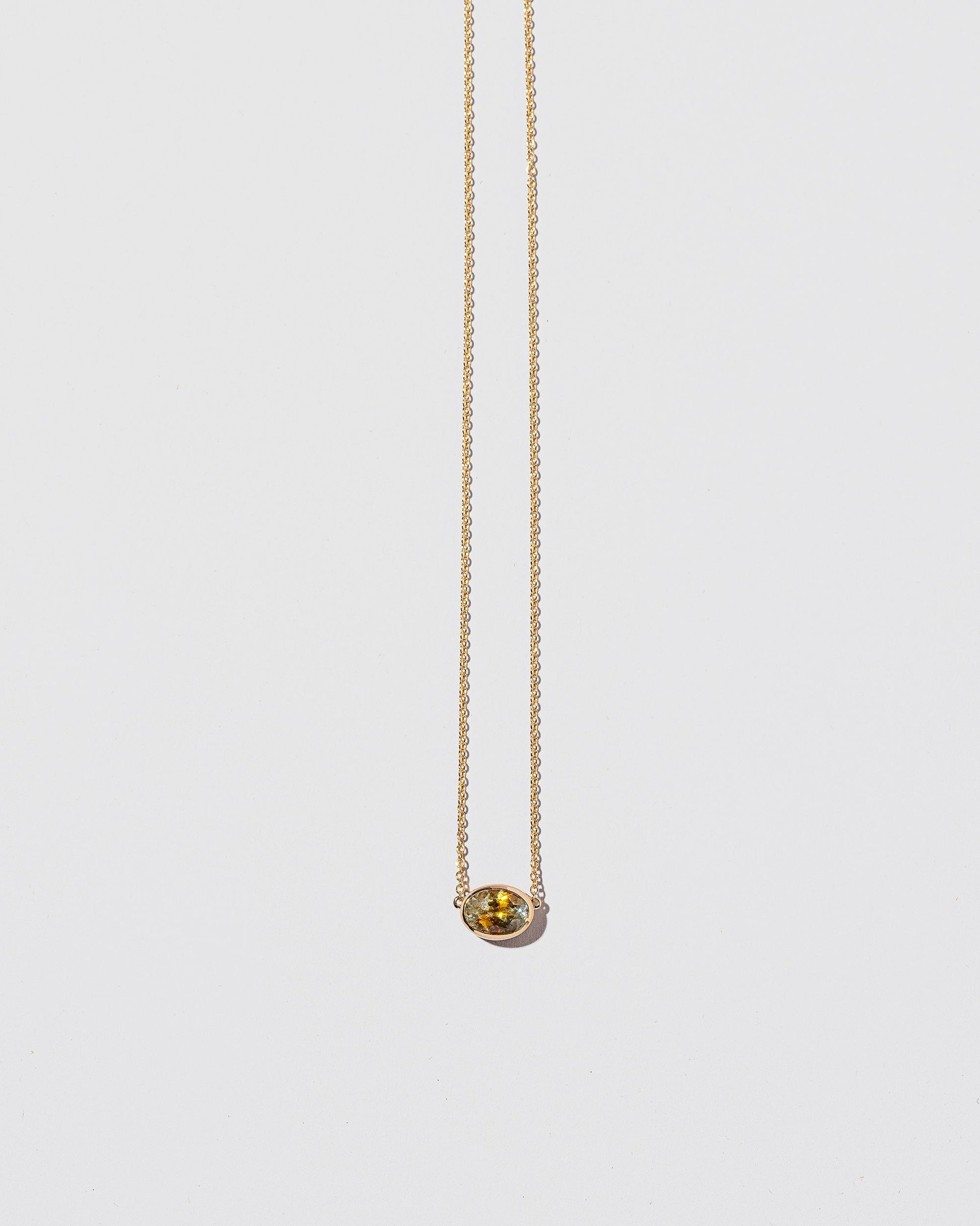  Motivation Necklace on light color background.