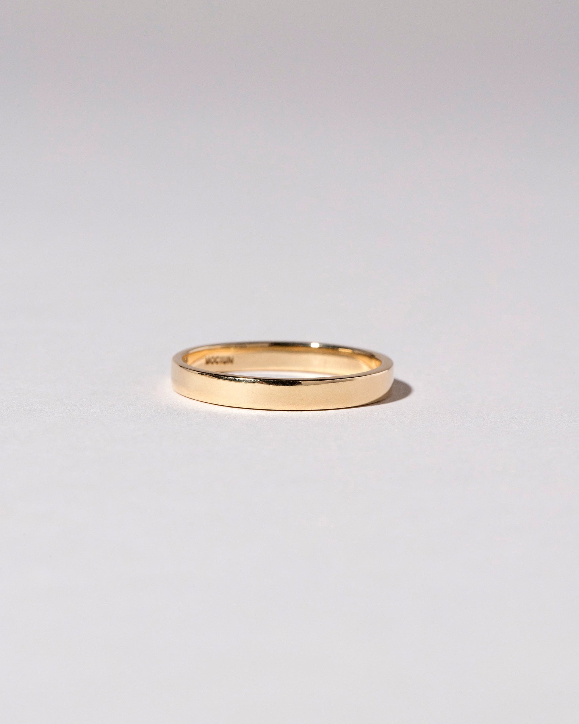 Gold 3mm Square Wire Band on light color background.