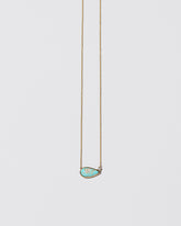 Protection Necklace on light color background.