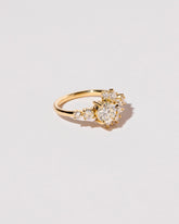  White Diamond Crescent Ring on light color background.