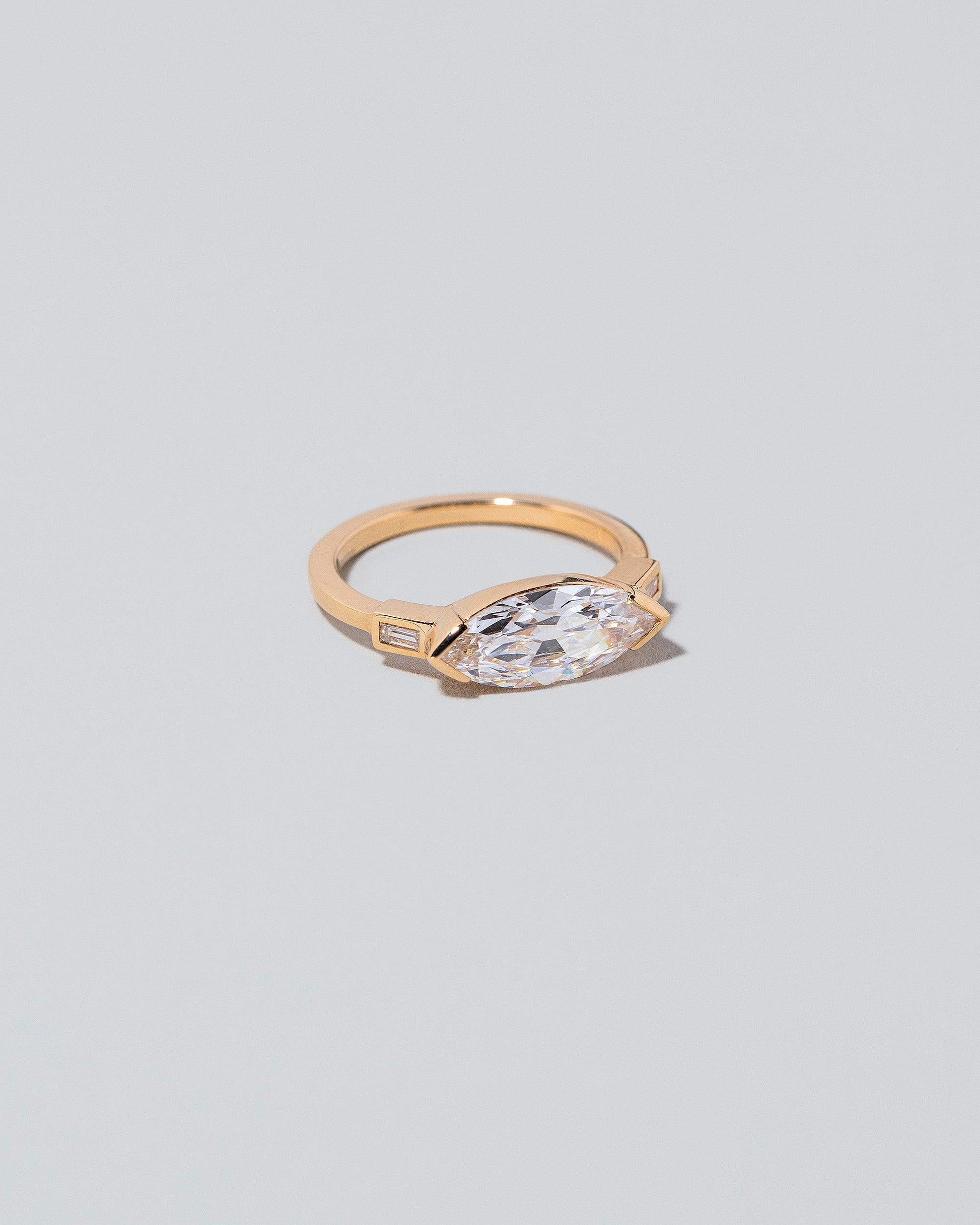 View from the side of the Fins Ring on light color background.