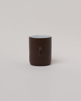 Rami Kim Chocolate Mini Face Tumbler on light color background.