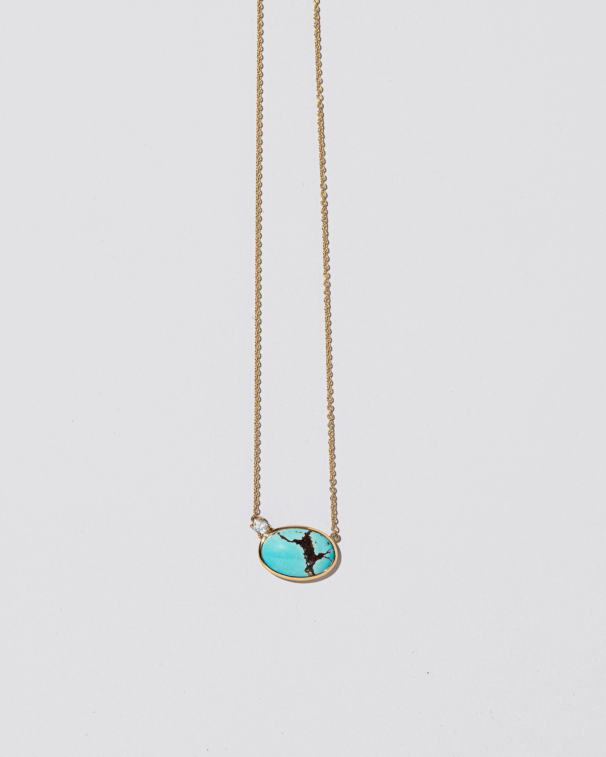 In-Between Necklace on light color background.