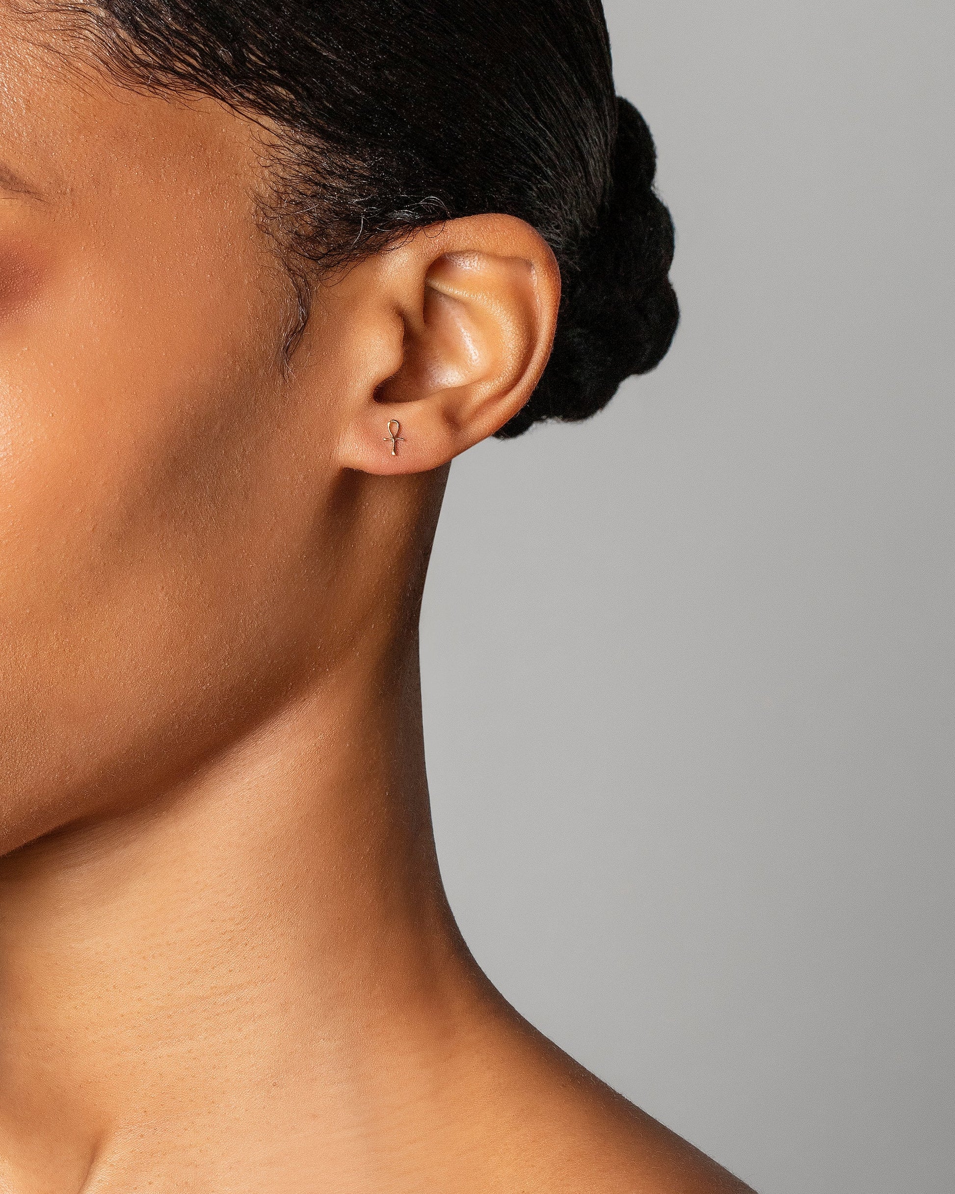 Ankh Stud Earring Single on model.
